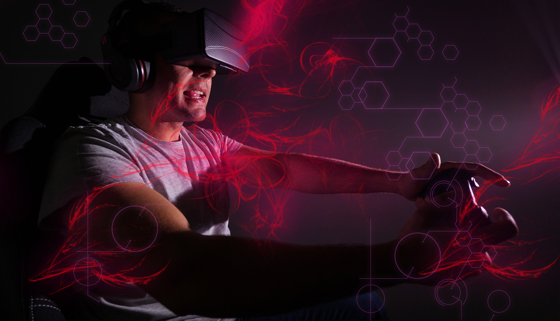Man intensely playing video games with red neon effects.